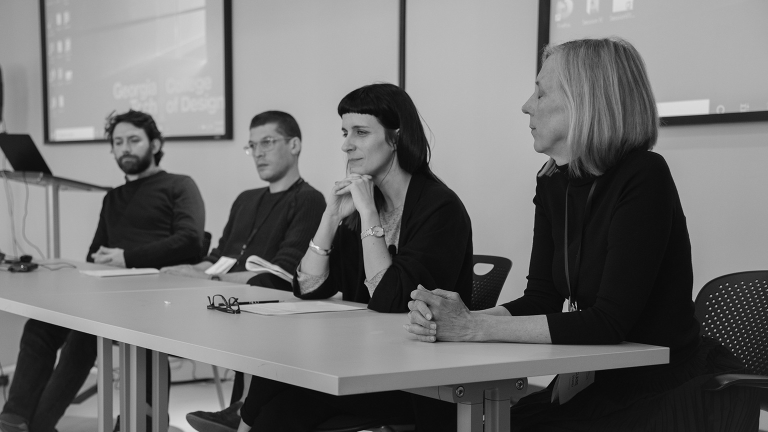 Black-and-white photo of a discussion panel